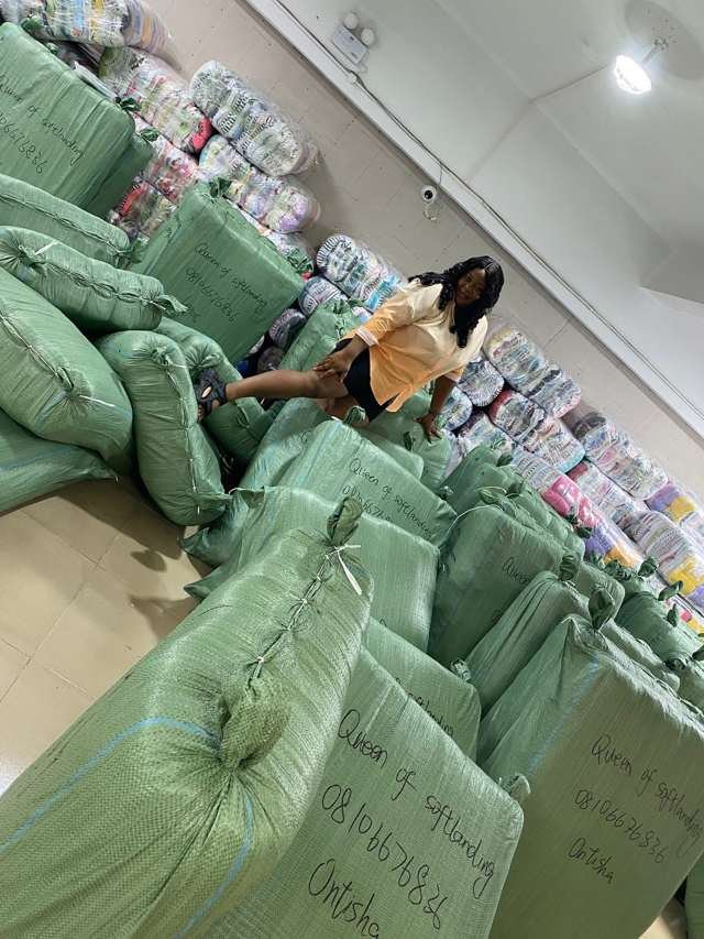 Warehouse full of sacks labelled Queen of Softlanding heading to Lagos and Onitsha